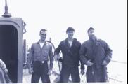 Elmer 
Fredd, Mike Lambert, Fred w Brown Ready to climb the Mast